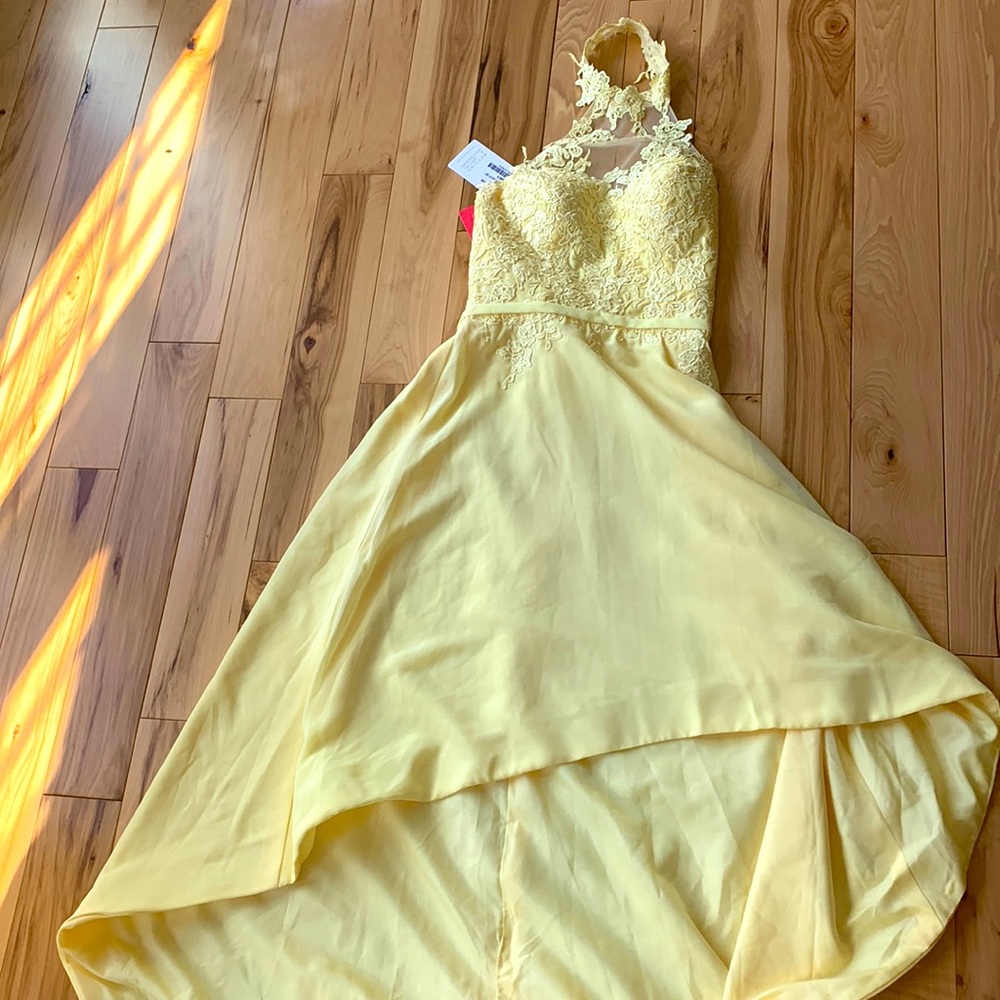 Yellow dress never worn still with tags brand new condition NO RETURNS :)